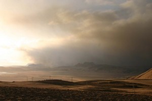 Photo taken west from Reynisfjall towards the sea, off the village Vík, south Iceland. Black ash obscuring the sunlight.