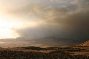 Photo taken west from Reynisfjall towards the sea, off the village Vík, south Iceland. Black ash obscuring the sunlight.